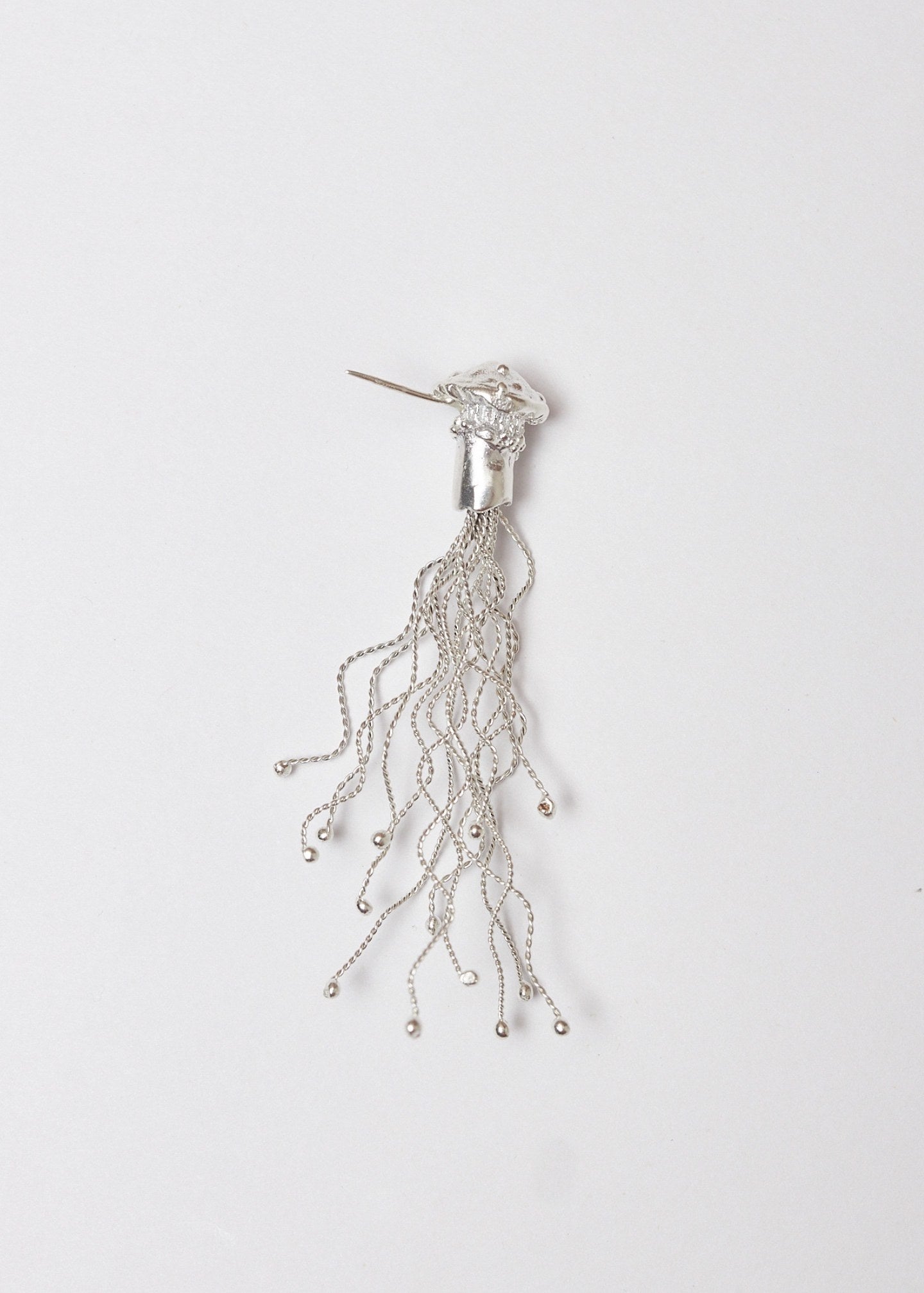 Arete/broche Miscelios plata